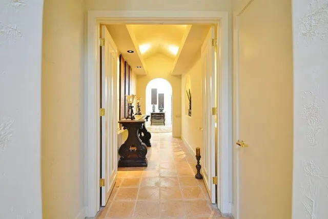 a view of a swimming pool and lounge chairs