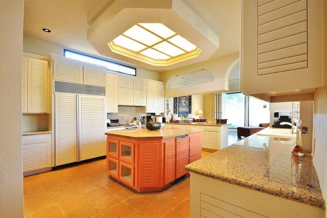 a large kitchen with a table and chairs
