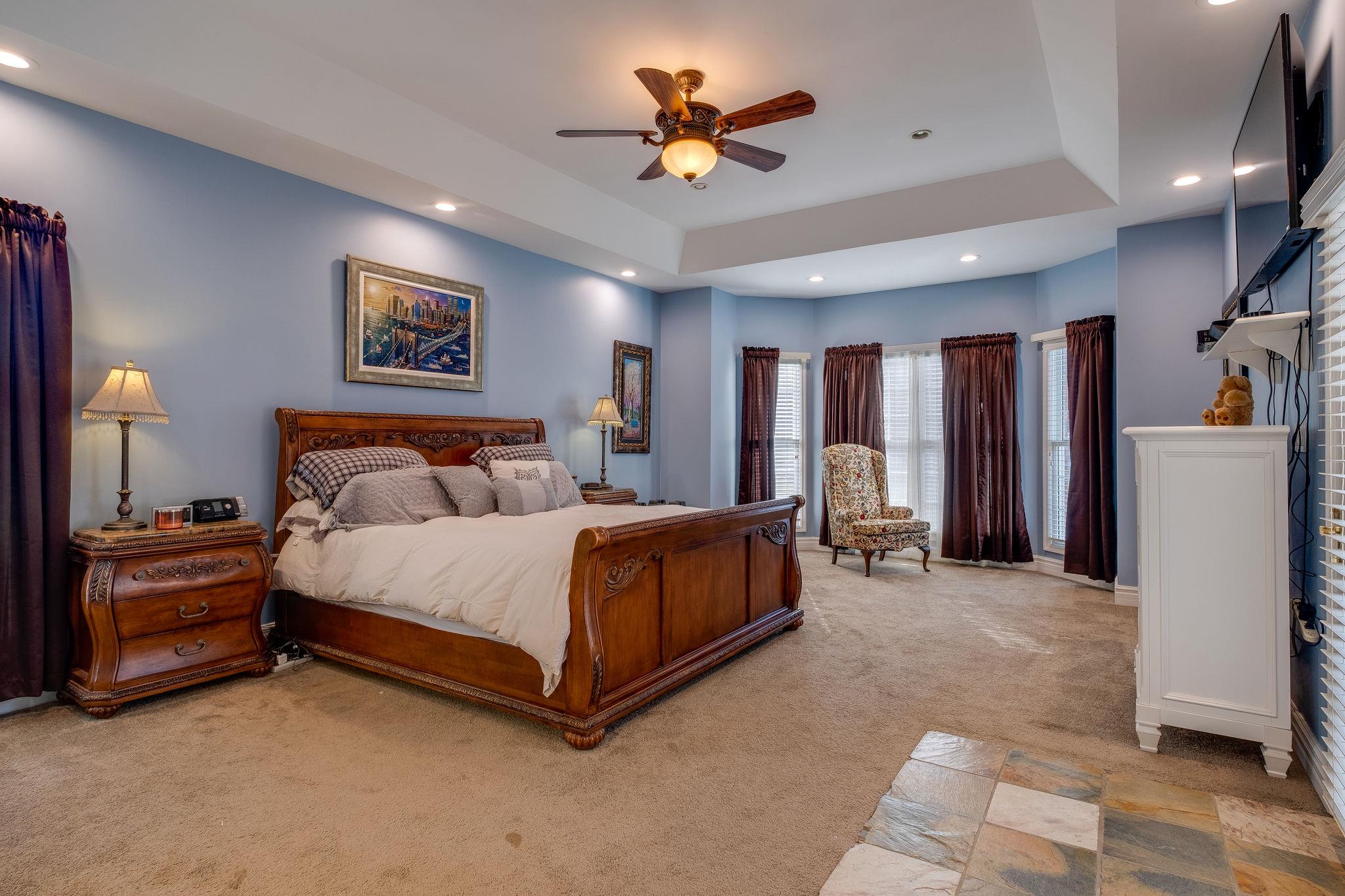 2700 Lone Oak Road Mount Juliet, TN 37122 - Photo 12 of 30 a spacious bedroom with a bed and a chandelier