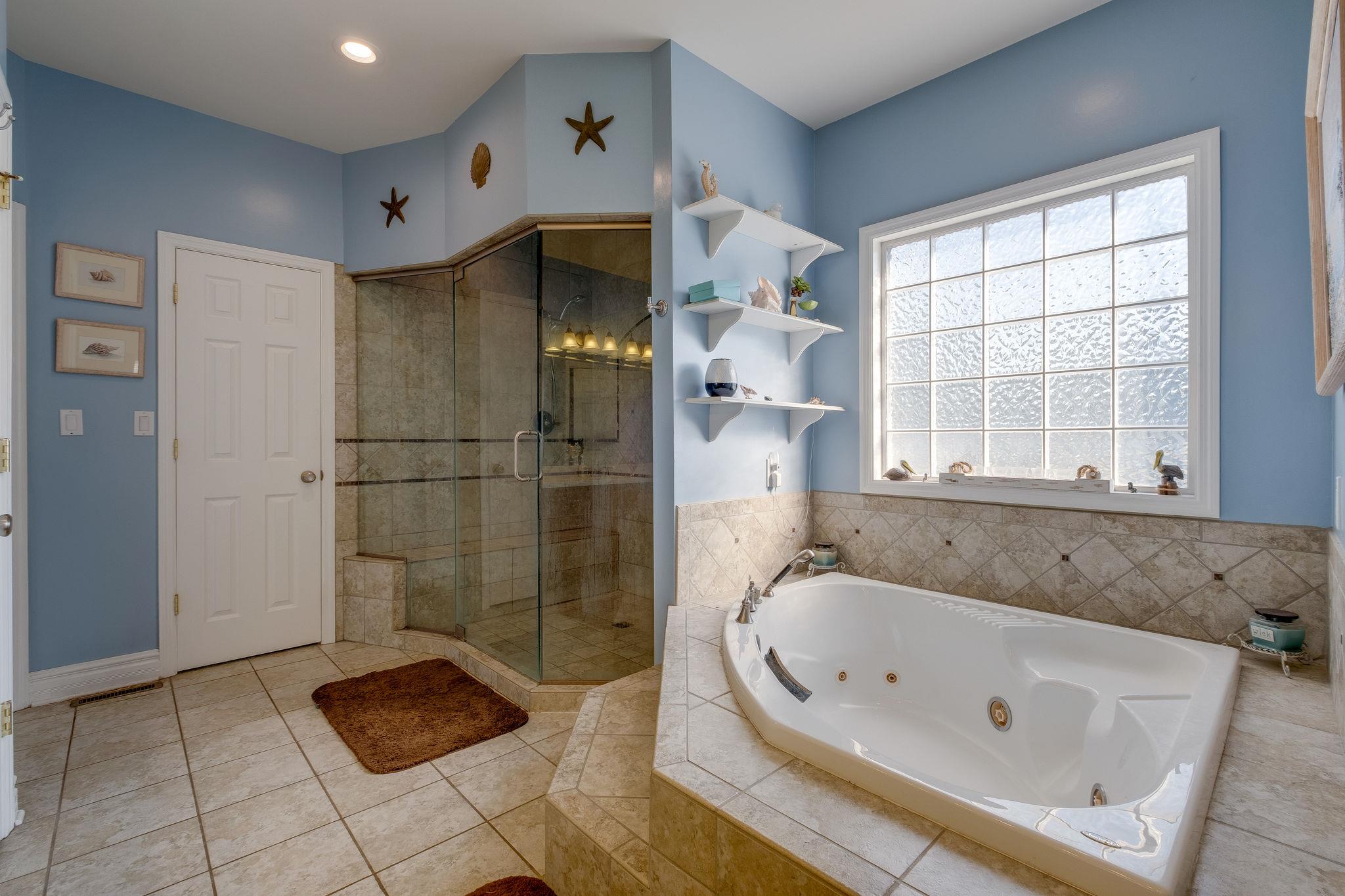 2700 Lone Oak Road Mount Juliet, TN 37122 - Photo 13 of 30 a bathroom with a tub and a shower
