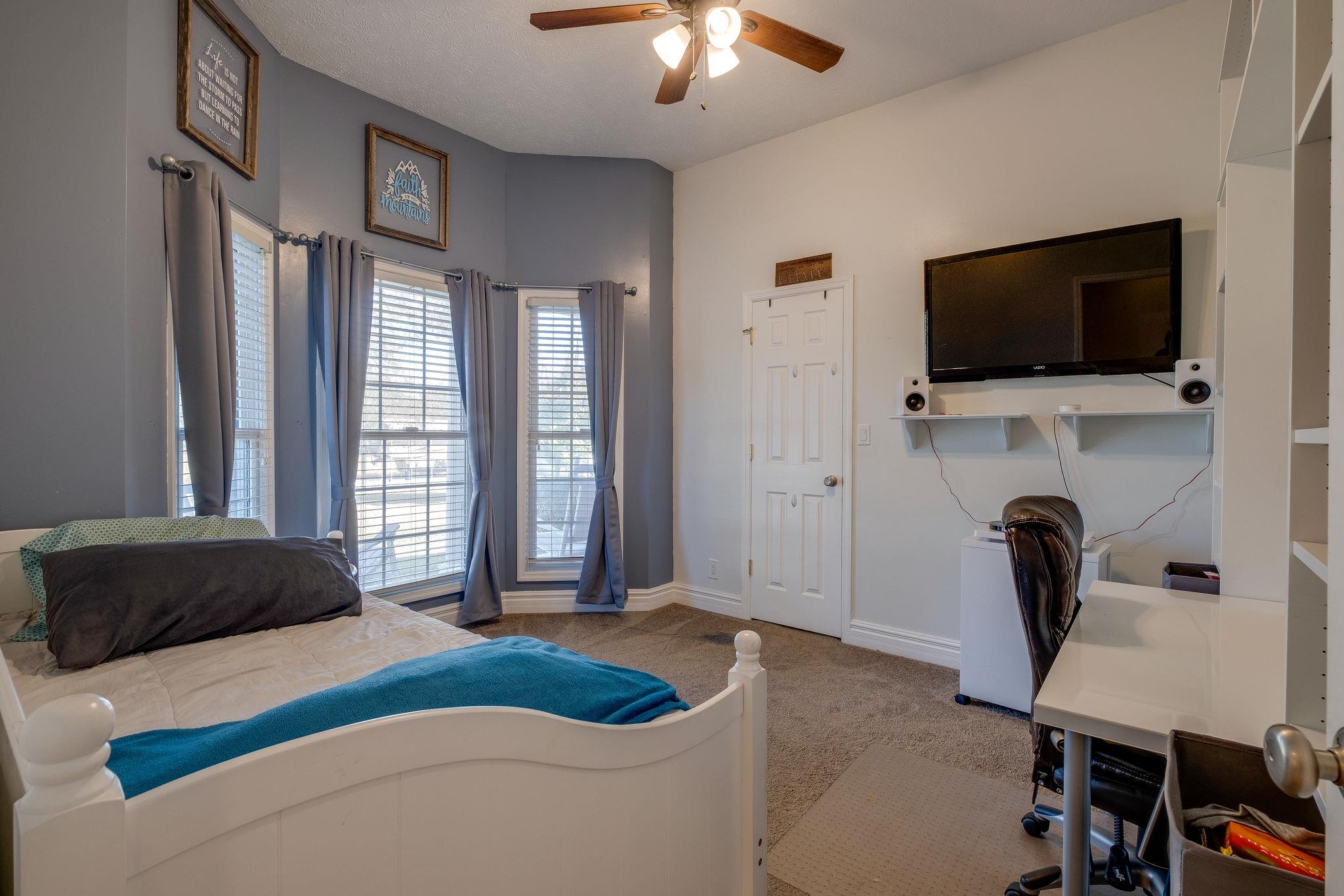 2700 Lone Oak Road Mount Juliet, TN 37122 - Photo 15 of 30 a bedroom with a bed tv and a window