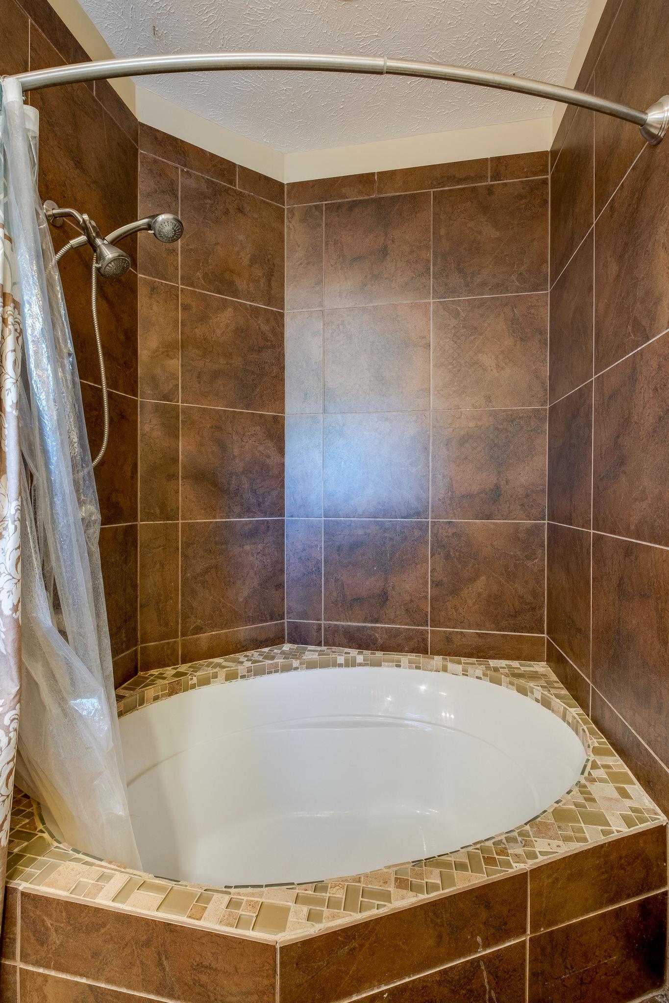 2700 Lone Oak Road Mount Juliet, TN 37122 - Photo 17 of 30 a bathroom with a shower and a bathtub