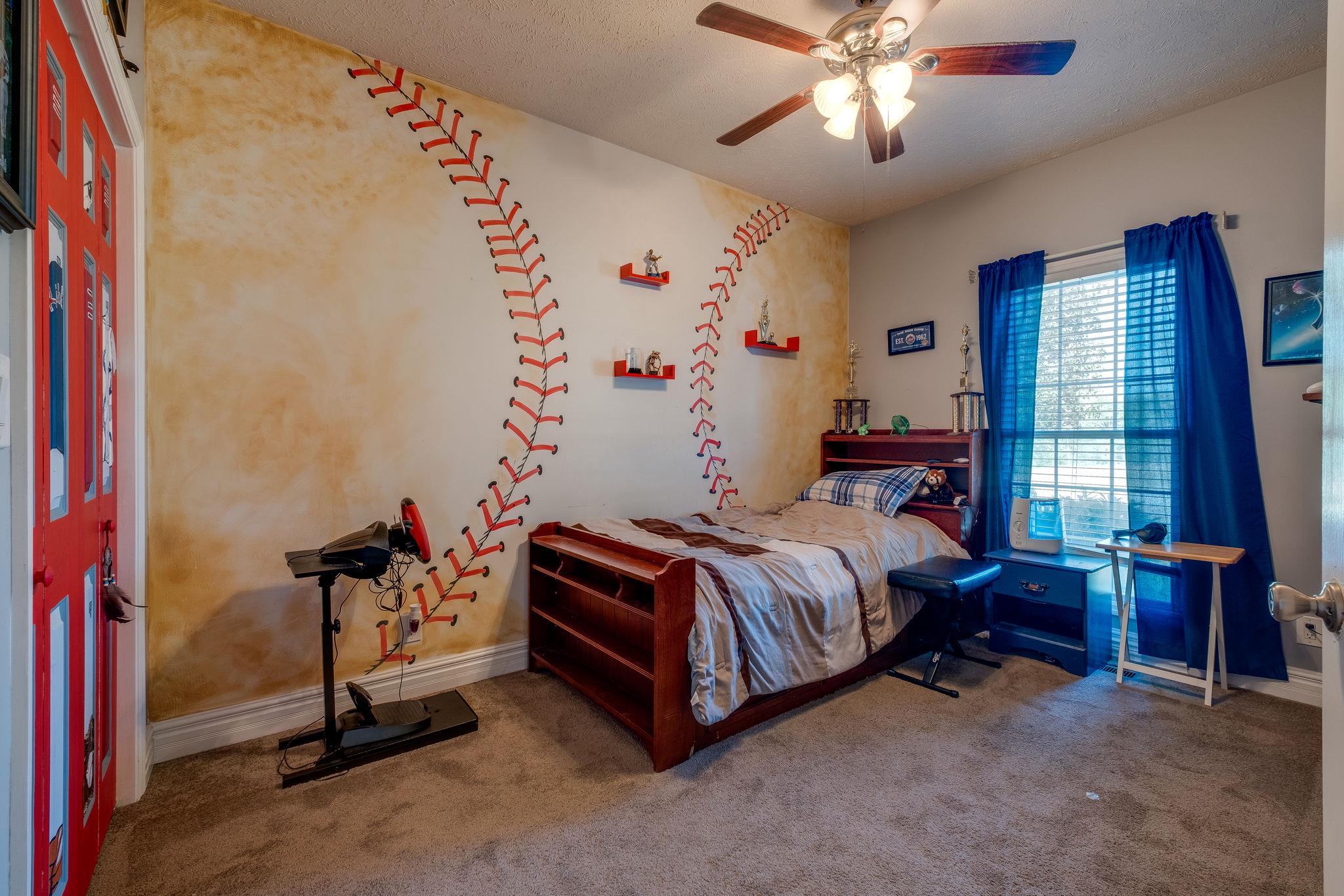 2700 Lone Oak Road Mount Juliet, TN 37122 - Photo 18 of 30 a bed room with a bed and a chandelier