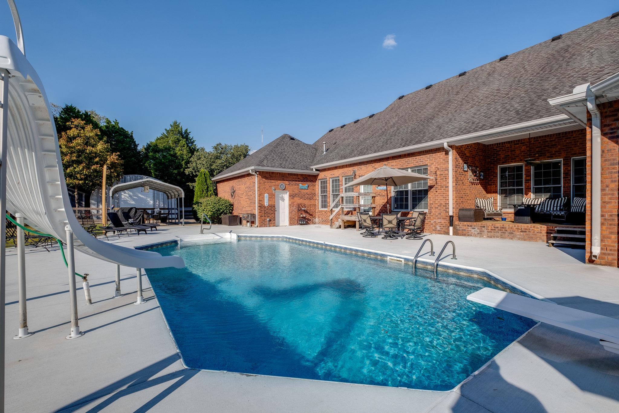 2700 Lone Oak Road Mount Juliet, TN 37122 - Photo 21 of 30 a view of swimming pool with lawn chairs and plants