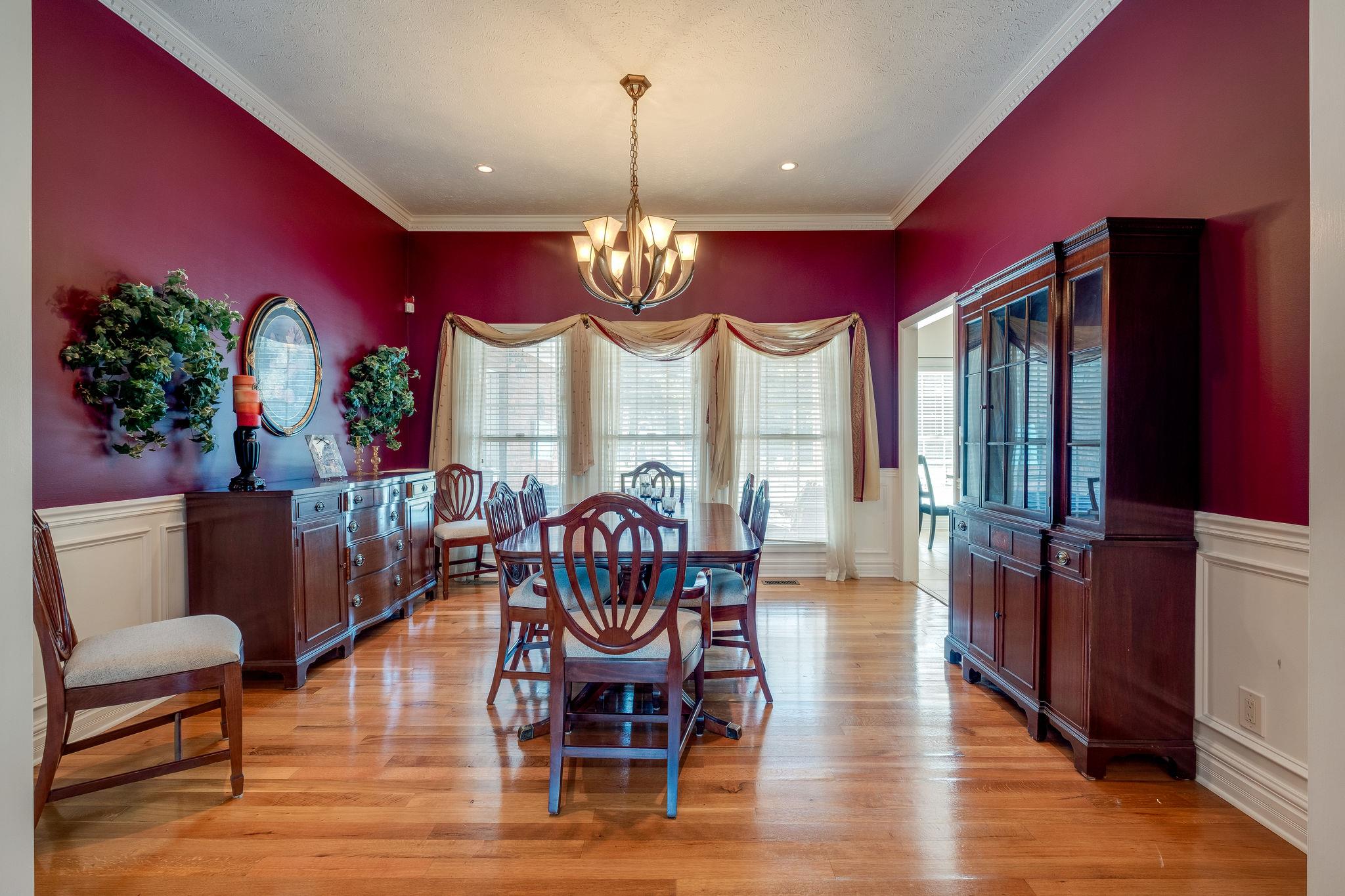 2700 Lone Oak Road Mount Juliet, TN 37122 - Photo 6 of 30 a dining room with furniture a chandelier and wooden floor