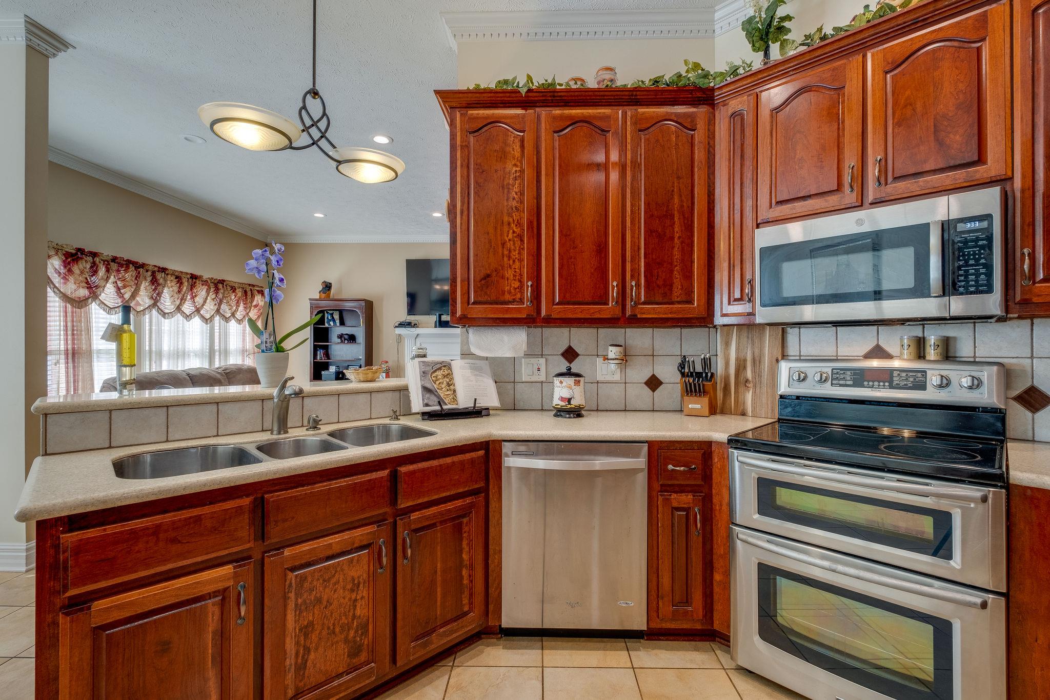2700 Lone Oak Road Mount Juliet, TN 37122 - Photo 8 of 30 a kitchen with a sink stove and microwave