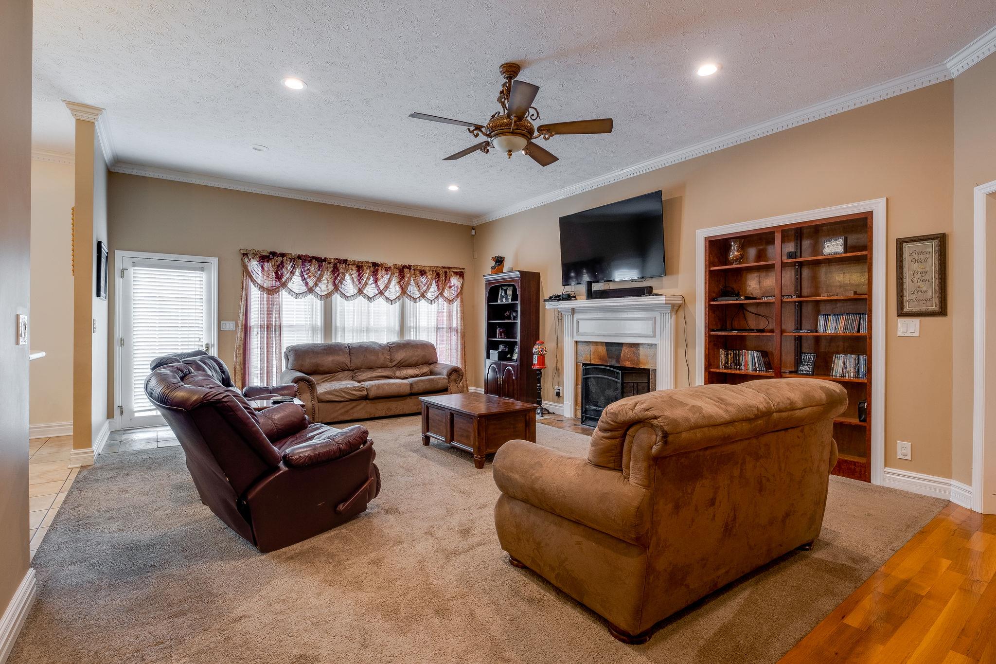 2700 Lone Oak Road Mount Juliet, TN 37122 - Photo 10 of 30 a living room with fireplace furniture and a flat screen tv