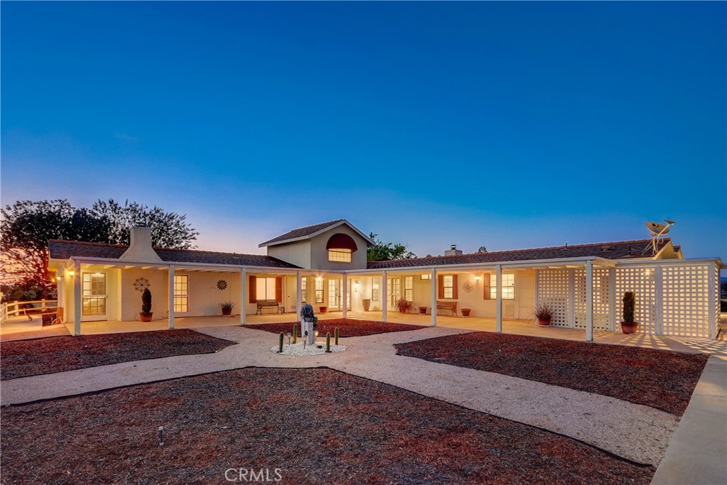 36020 Valencia Way Temecula, CA 92592 - Photo 1 of 1 a front view of a house with a yard