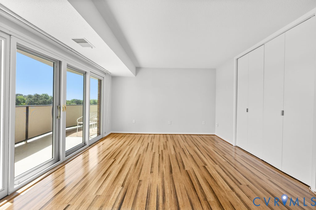 2956 Hathaway Road, Unit U704 Richmond, VA 23225 - Photo 19 of 42 Spacious room featuring wood-finish flooring, whit