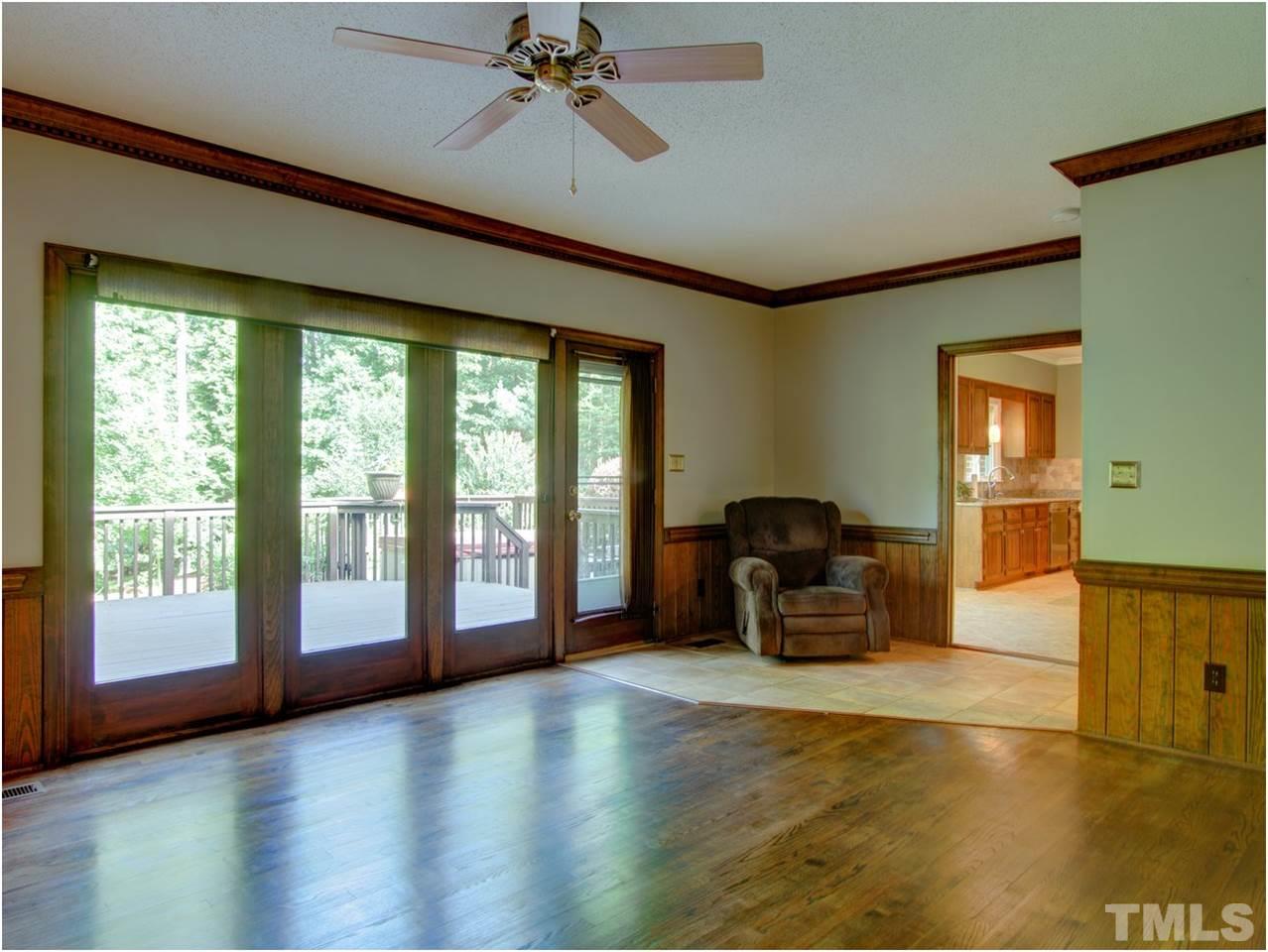 4709 Fallswood Place Raleigh, NC 27613 - Photo 20 of 25 a living room with furniture and a large window