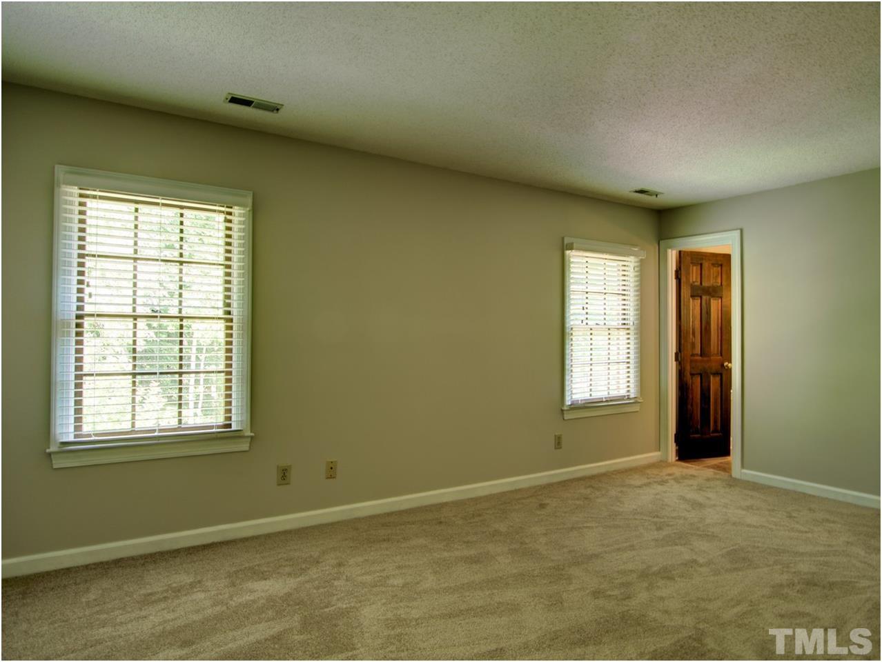 4709 Fallswood Place Raleigh, NC 27613 - Photo 23 of 25 a view of an empty room with a window