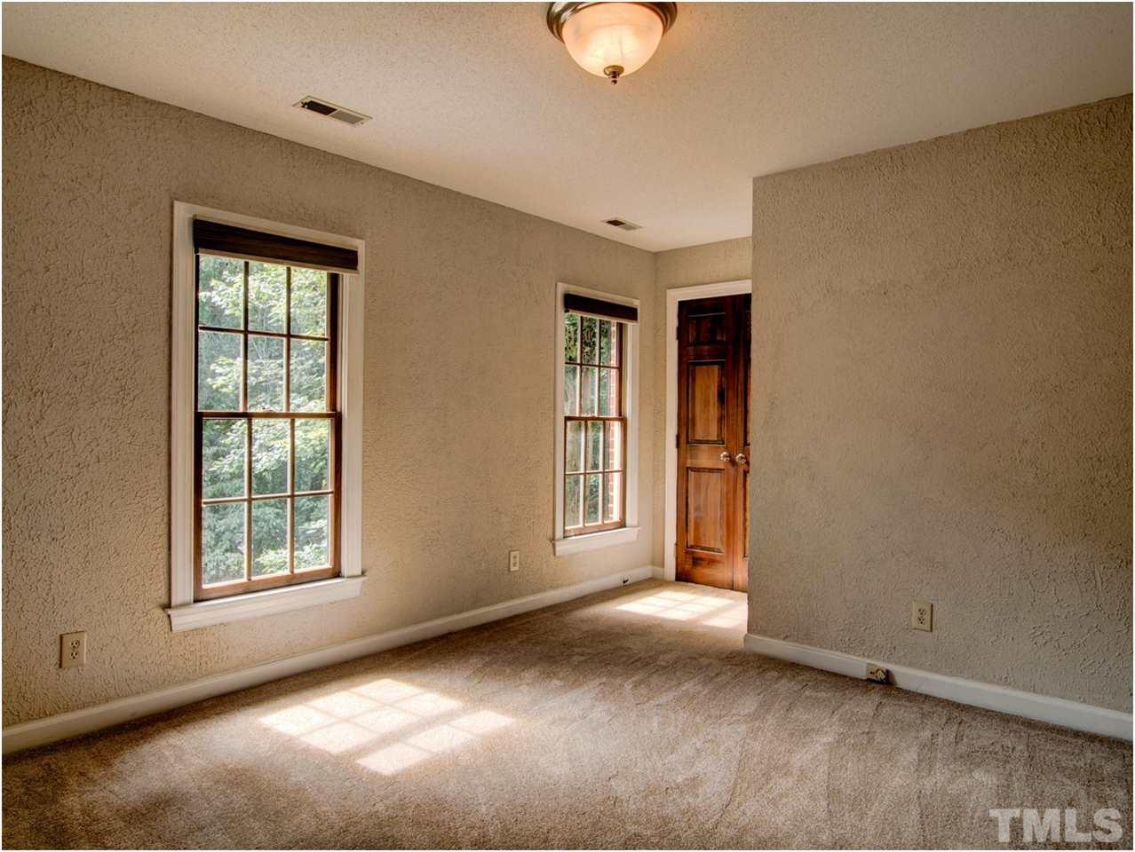 4709 Fallswood Place Raleigh, NC 27613 - Photo 24 of 25 an empty room with windows