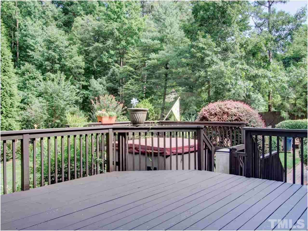 4709 Fallswood Place Raleigh, NC 27613 - Photo 4 of 25 a balcony with wooden floor and fence