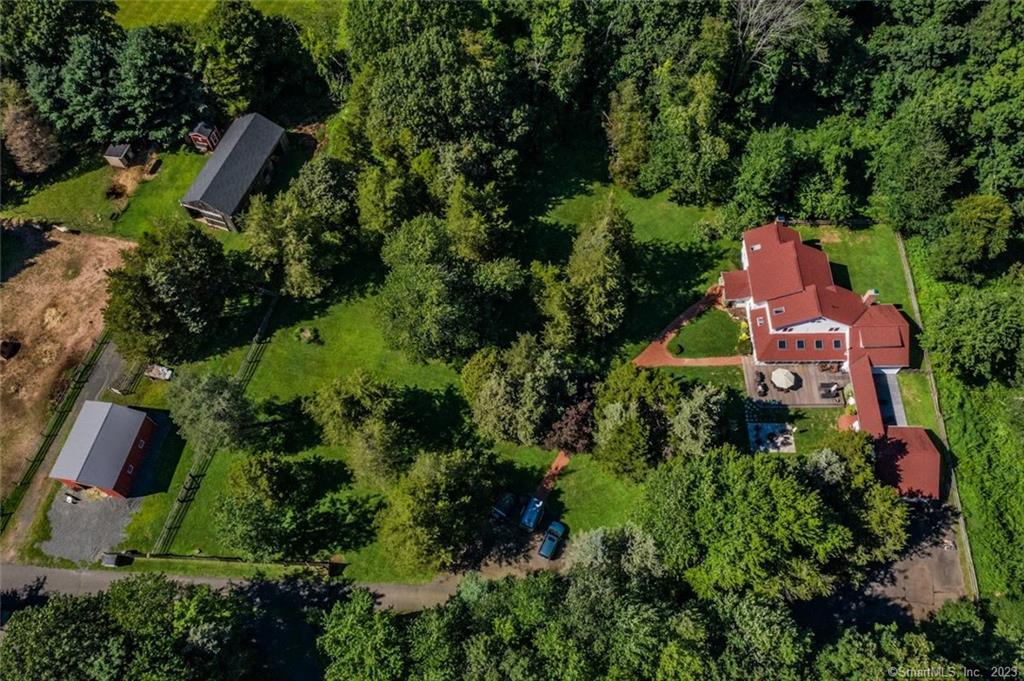164 Tuttle Road Durham, CT 06422 - Photo 1 of 1 an aerial view of a house with a yard and outdoor seating