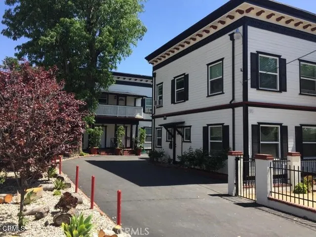 a front view of a house with street