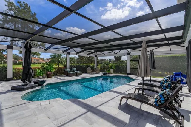 a view of a backyard with sitting area