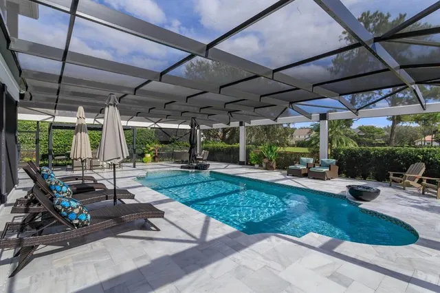 a view of a backyard with sitting area