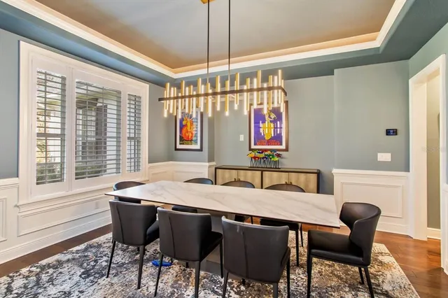 a view of a dining room with furniture and window