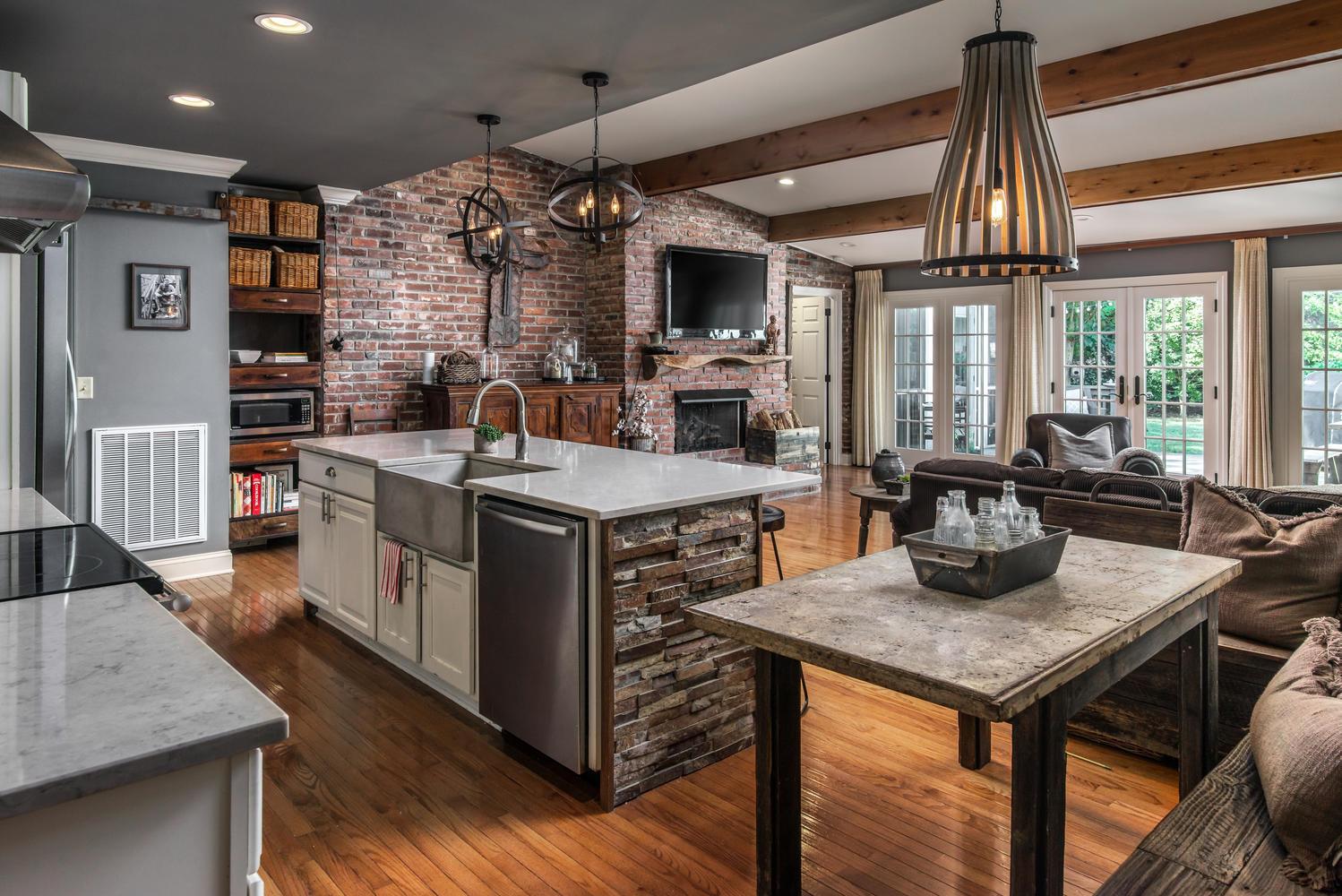 401 Page Road Nashville, TN 37205 - Photo 2 of 30 Updated Kitchen boasts quartz countertops & stacked stone o the island, backsplash and wall!