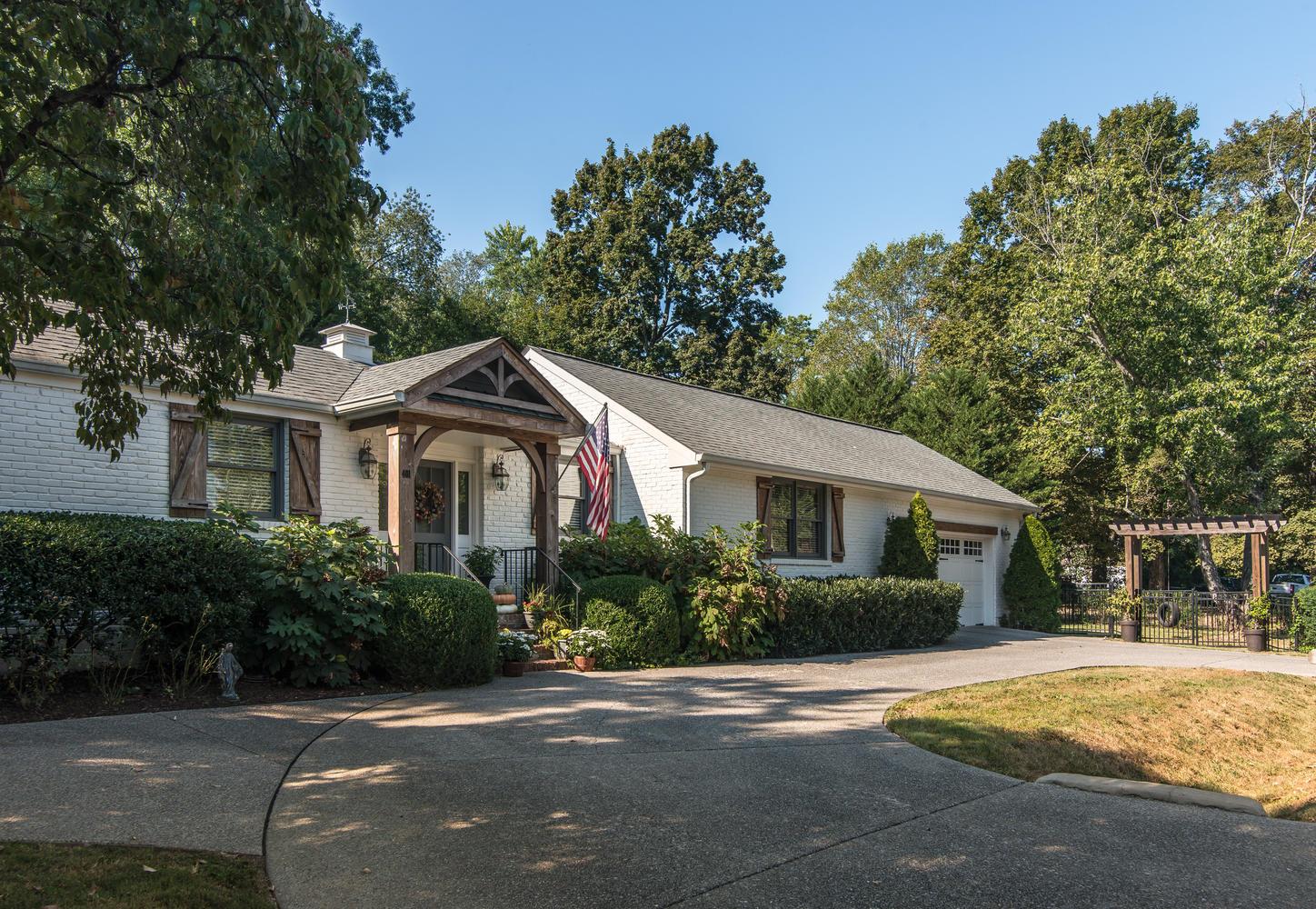 401 Page Road Nashville, TN 37205 - Photo 7 of 30 Side entrance off Cheek Road is ideal for day to day life! The attached two car garage is insulated and can be heated/cooled! If you've got musical instruments that need to be stored - this is perfect for you! Circular drive offers easy access!