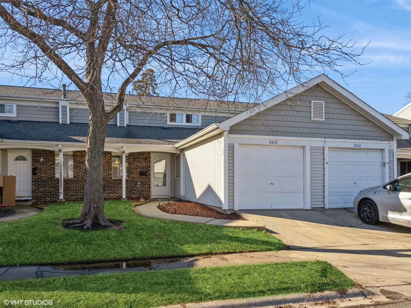 2012 Raleigh Place Hoffman Estates, IL 60169 - Photo 1 of 14 a front view of house with yard