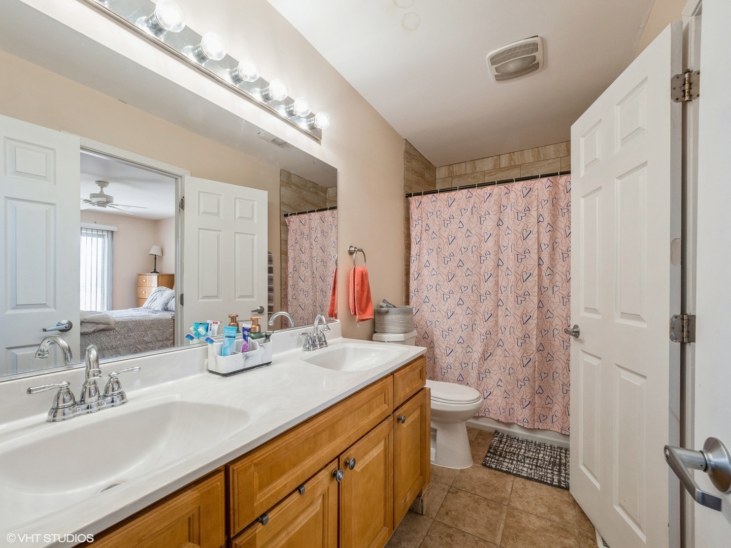 2012 Raleigh Place Hoffman Estates, IL 60169 - Photo 11 of 14 a bathroom with a double vanity sink mirror and toilet