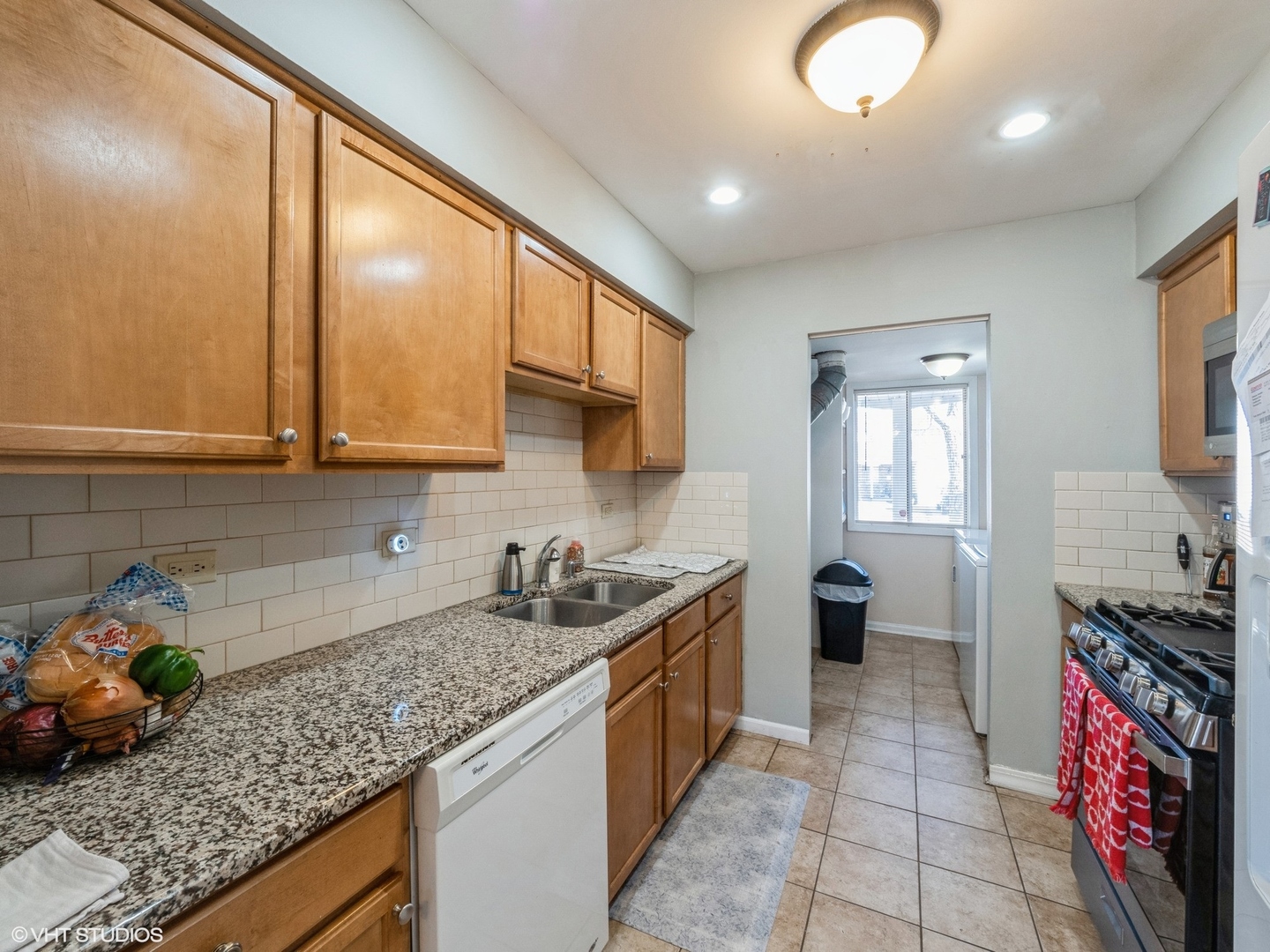 2012 Raleigh Place Hoffman Estates, IL 60169 - Photo 4 of 14 a kitchen with stainless steel appliances granite countertop a sink stove and cabinets