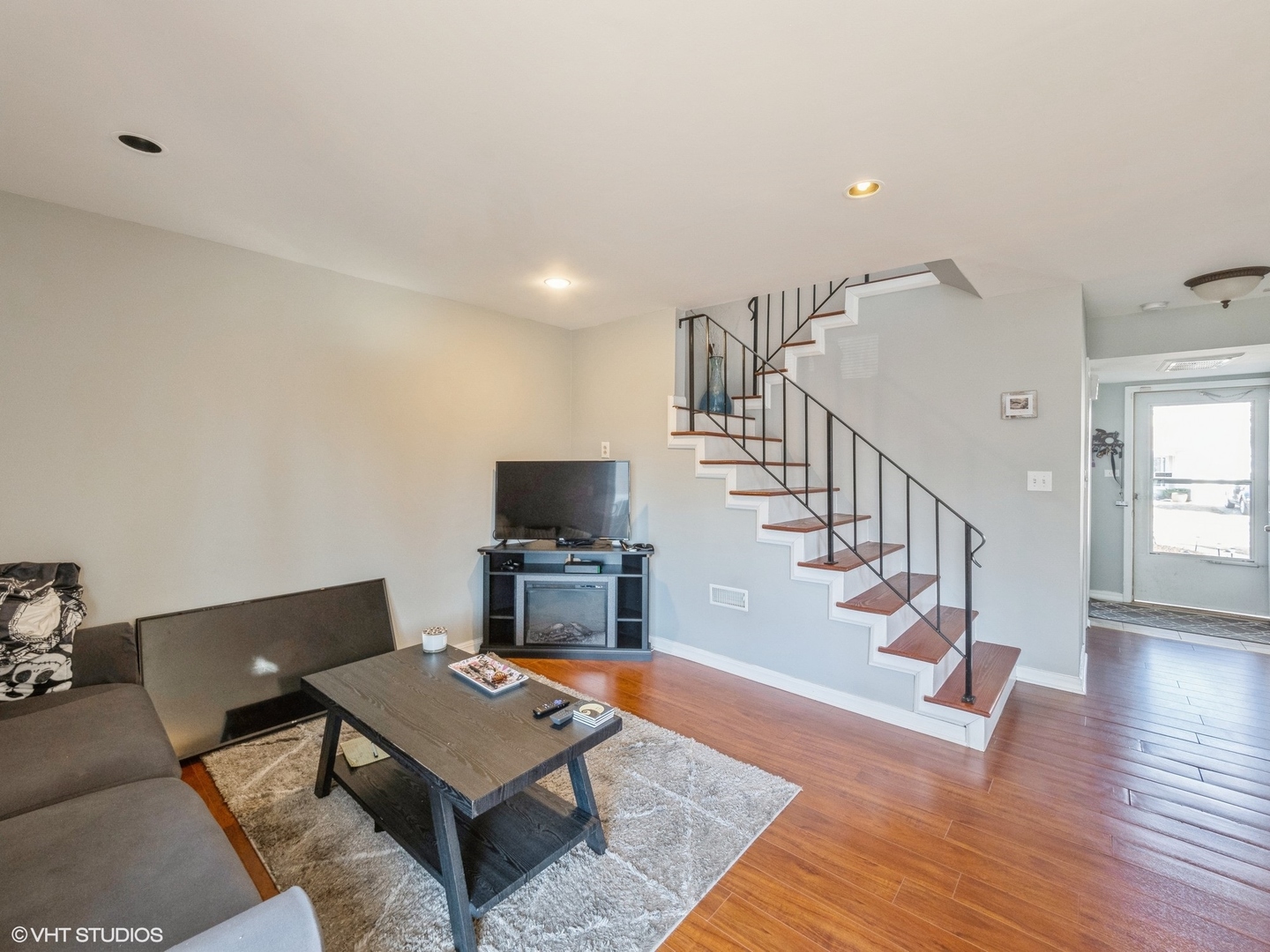 2012 Raleigh Place Hoffman Estates, IL 60169 - Photo 5 of 14 a living room with furniture a rug and a flat screen tv