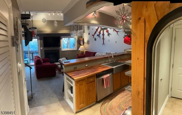 a kitchen with stainless steel appliances granite countertop a stove and a sink