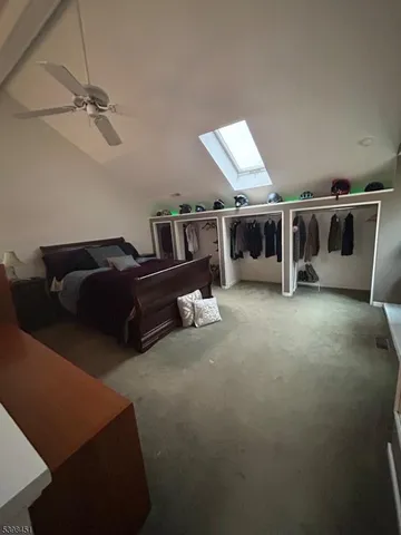 a living room with furniture a air conditioner vent and a window