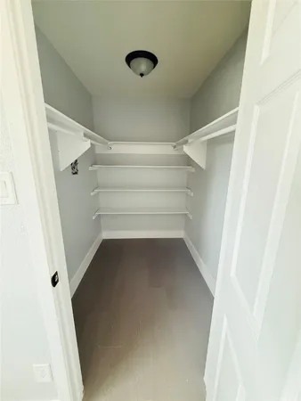 a view of an empty walk in closet