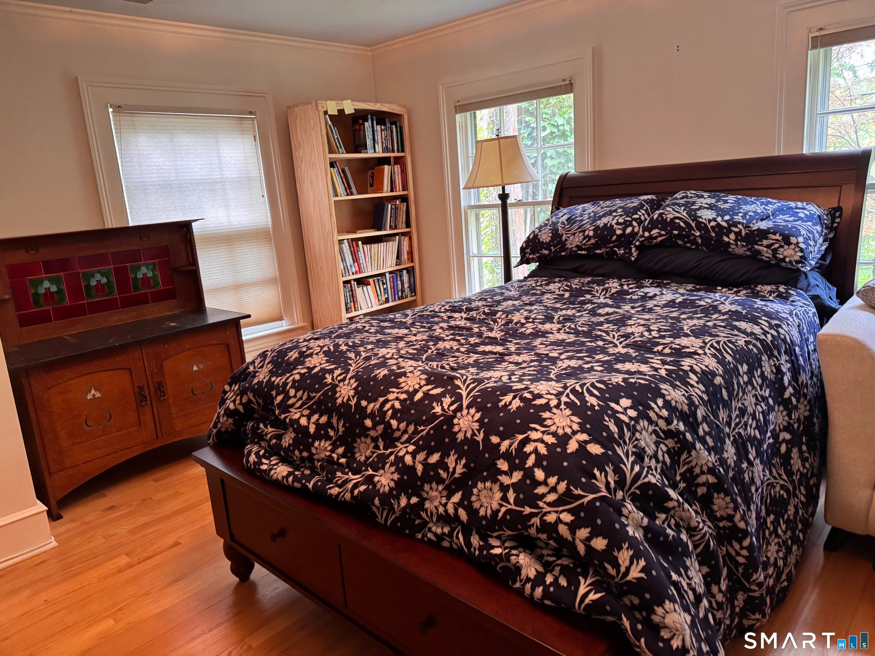 57 Mill Rock Road Hamden, CT 06517 - Photo 15 of 24 a bedroom with a bed window and book shelf