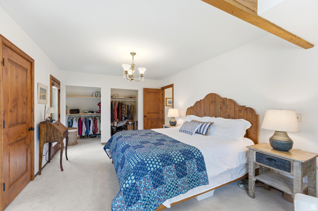 2635 Little Kate Road, Unit 21 Park City, UT 84060 - Photo 25 of 39 Bedroom with carpet floors, a chandelier, and a closet