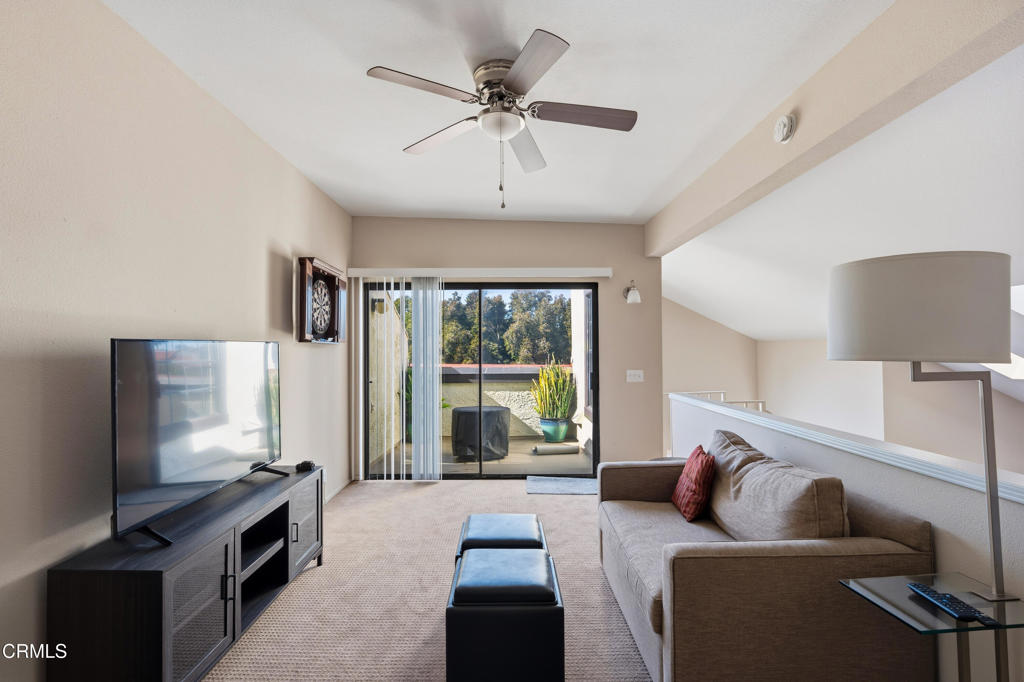 4427 Antigua Way Oxnard, CA 93035 - Photo 25 of 43 a living room with furniture and a flat screen tv