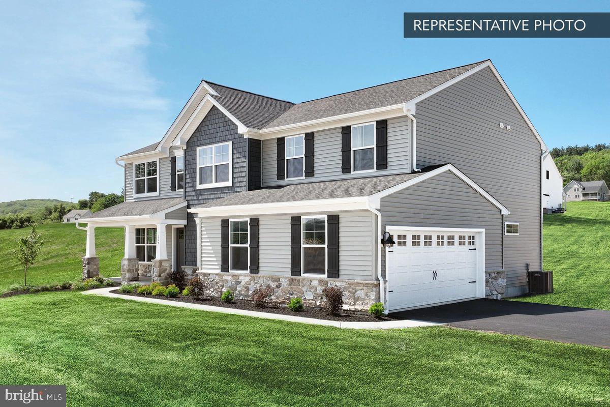 2010 Settlers Ridge Road Slatington, PA 18080 - Photo 2 of 21 a front view of a house with a yard and garage