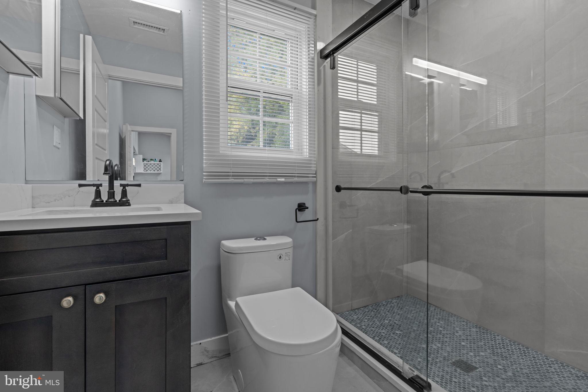 245 Trenton Road Fairless Hills, PA 19030 - Photo 21 of 43 a bathroom with a sink a toilet and shower