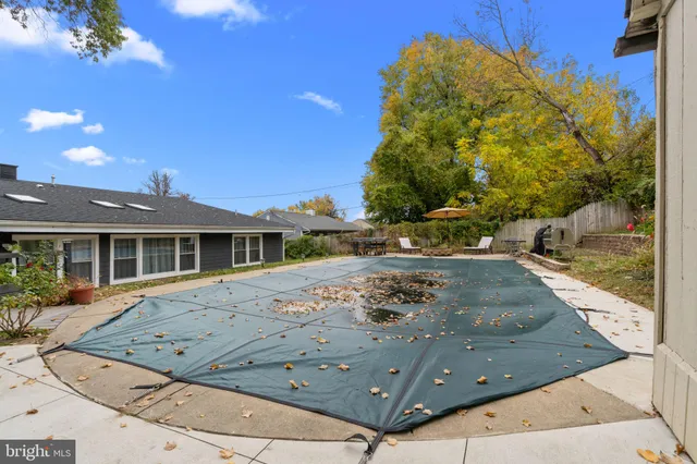 a view of backyard with outdoor seating and stairs