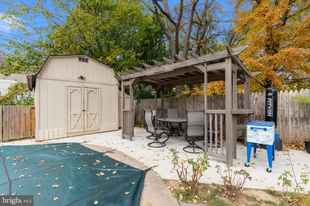 a view of balcony with wooden floor and fence