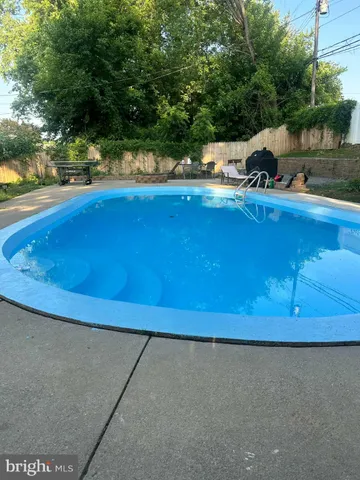 a view of swimming pool from a balcony