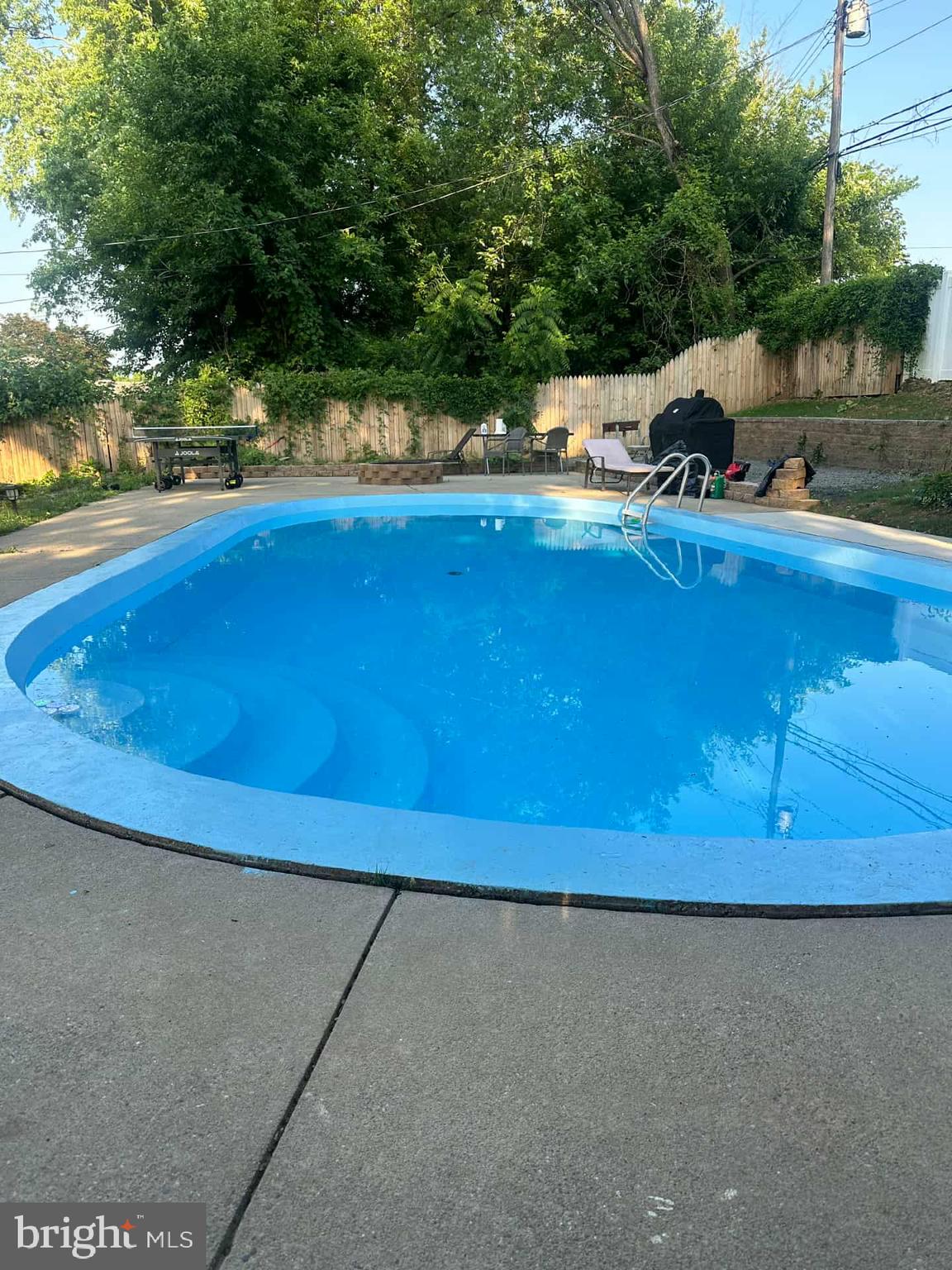 245 Trenton Road Fairless Hills, PA 19030 - Photo 40 of 43 a view of swimming pool with a yard and outdoor seating