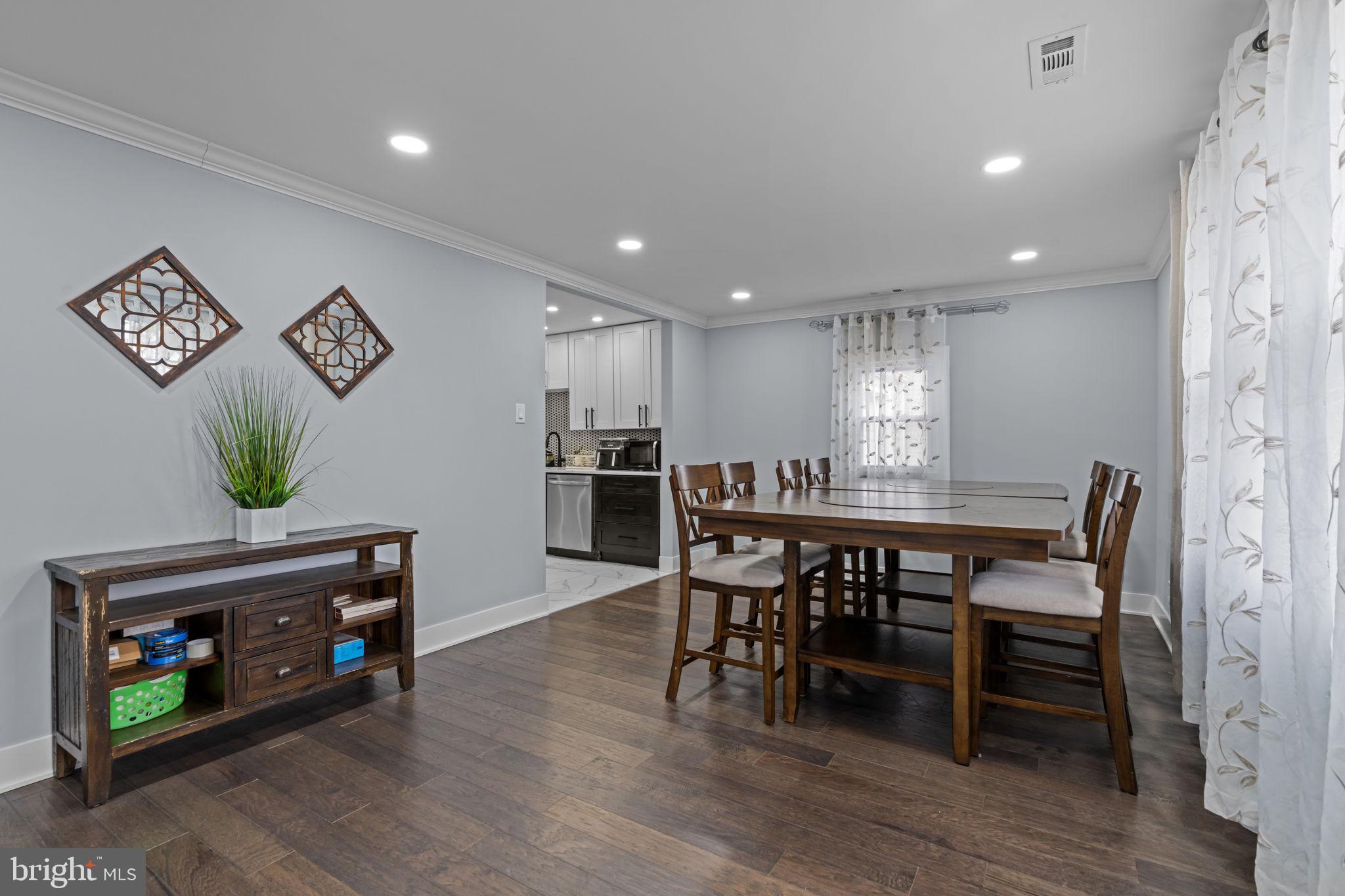 245 Trenton Road Fairless Hills, PA 19030 - Photo 4 of 43 a view of a dining room with furniture and wooden floor