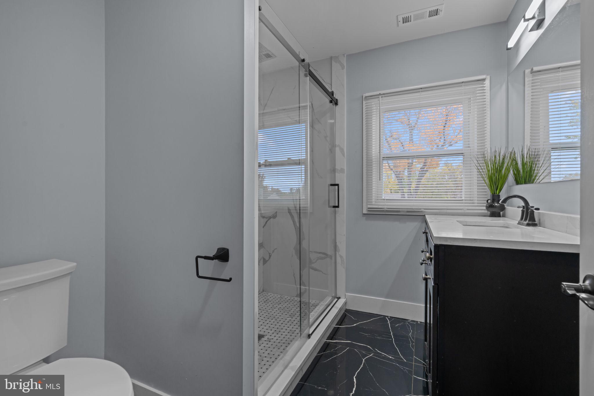 245 Trenton Road Fairless Hills, PA 19030 - Photo 6 of 43 a bathroom with a sink toilet and shower