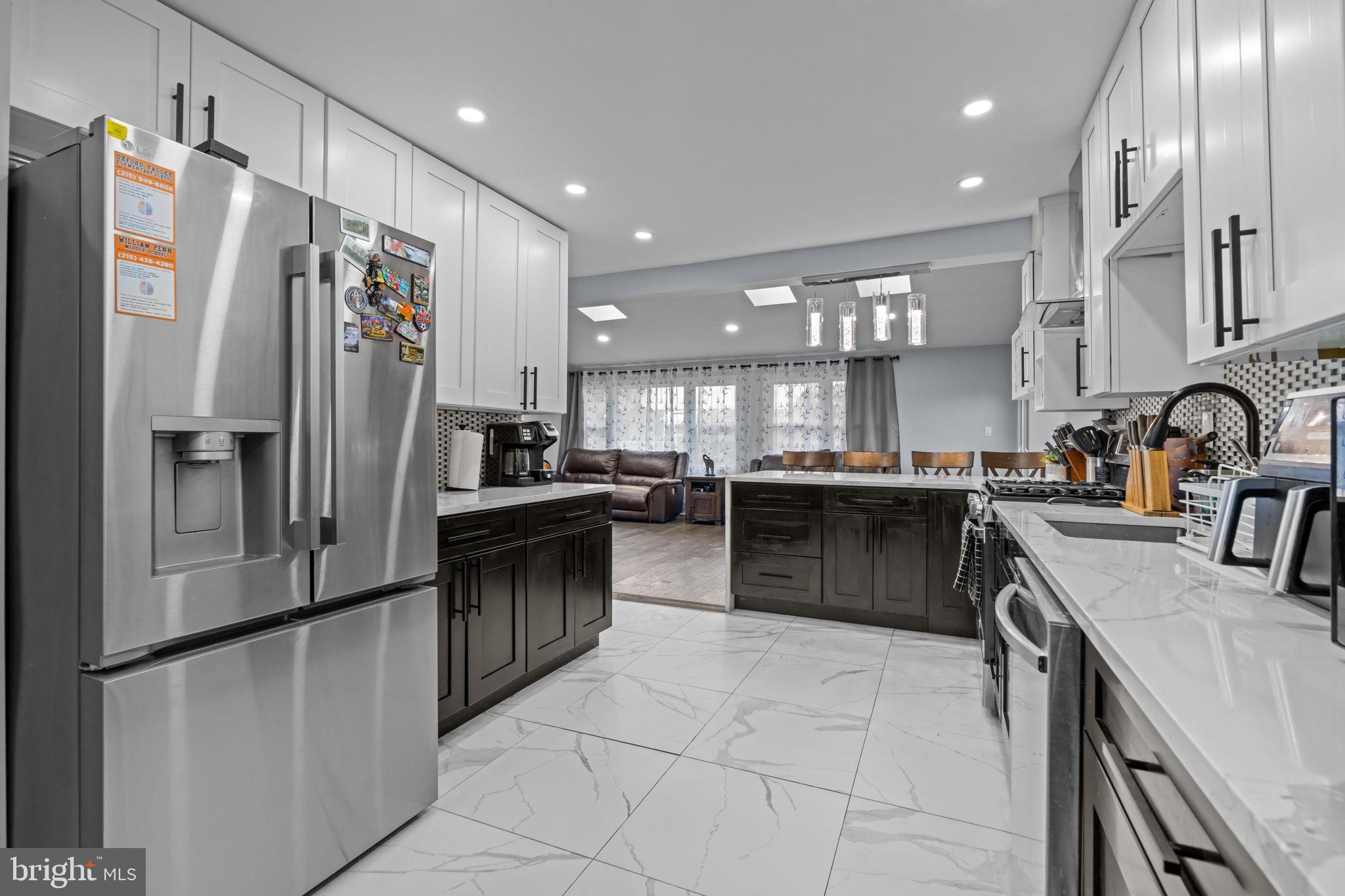 245 Trenton Road Fairless Hills, PA 19030 - Photo 10 of 43 a kitchen with stainless steel appliances granite countertop a refrigerator a sink a stove and a refrigerator