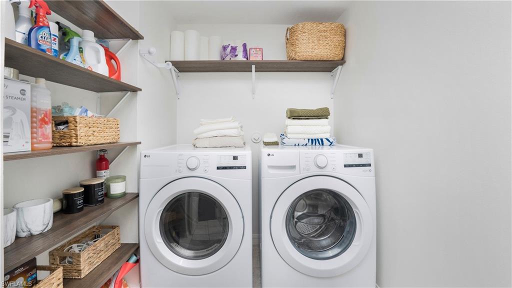 4957 Pepper Circle, Unit C104 Naples, FL 34113 - Photo 14 of 22 a utility room with dryer and washer