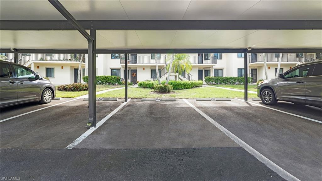 4957 Pepper Circle, Unit C104 Naples, FL 34113 - Photo 22 of 22 a view of parking area