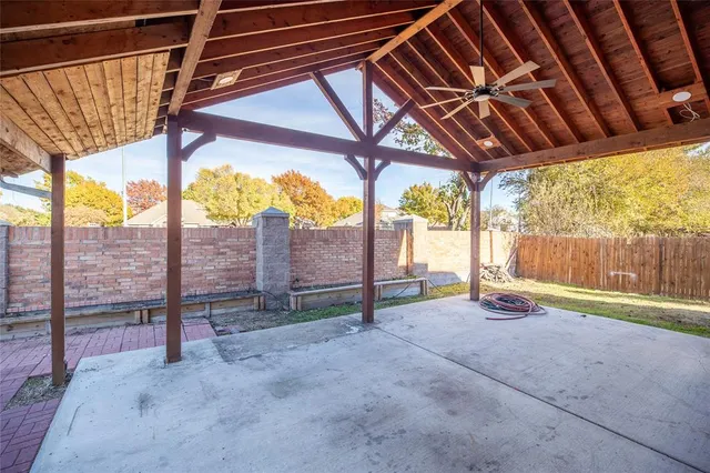 a view of empty room with floor to ceiling windows