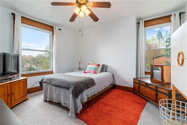 a bed room with a bed and a chandelier
