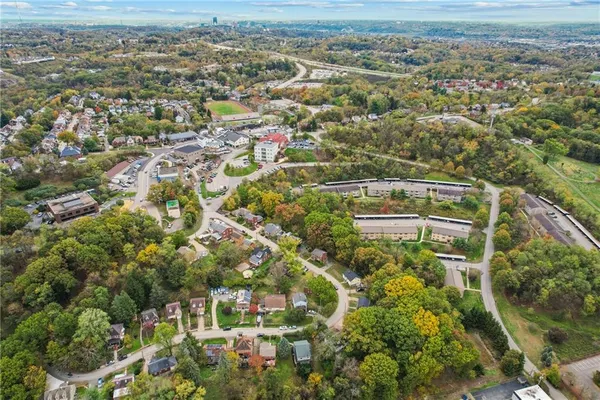 an aerial view of residential houses with outdoor space