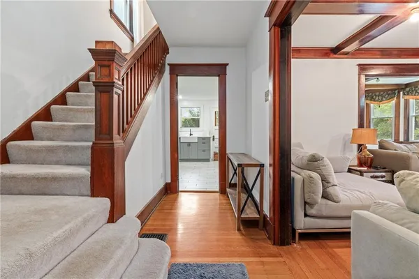 a living room with furniture and a entryway