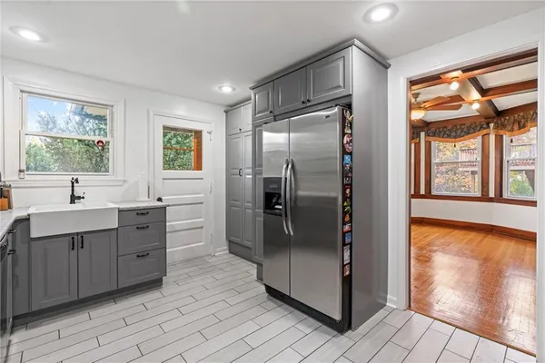 a kitchen with stainless steel appliances a refrigerator and a sink